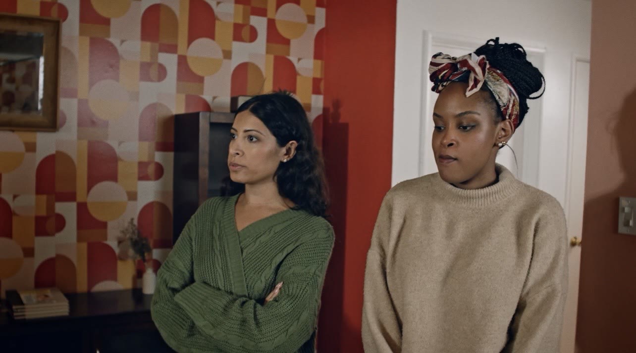 Still from Chiamara and Poorvi — two friends sharing a moment in an apartment